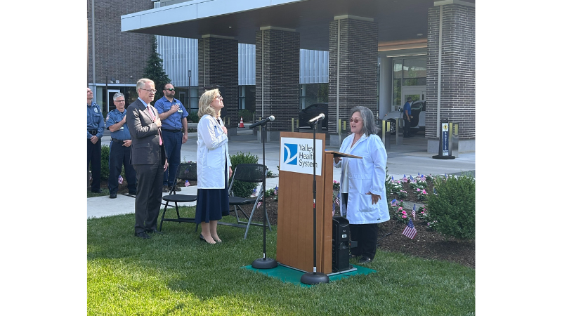 employee singing the national anthem