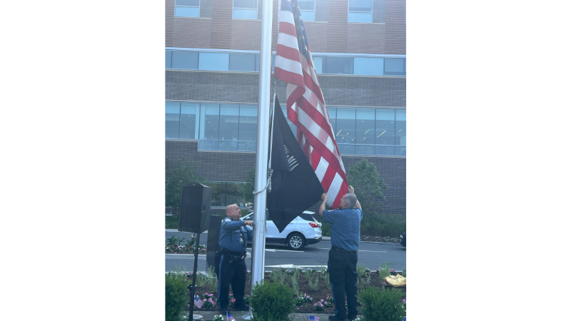 hospital security guards raising the american flag