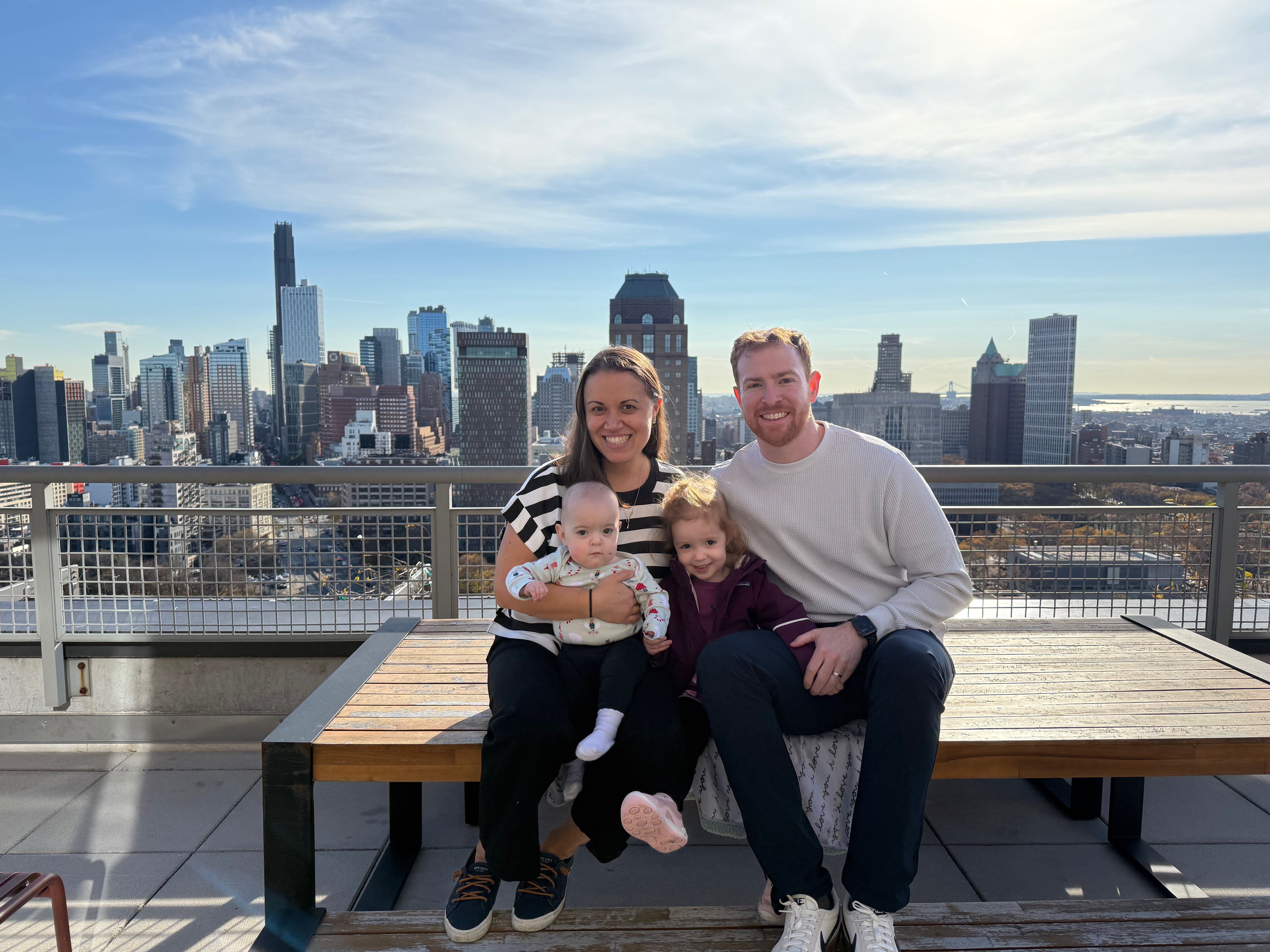 Marissa's family in front of a NYC skyline