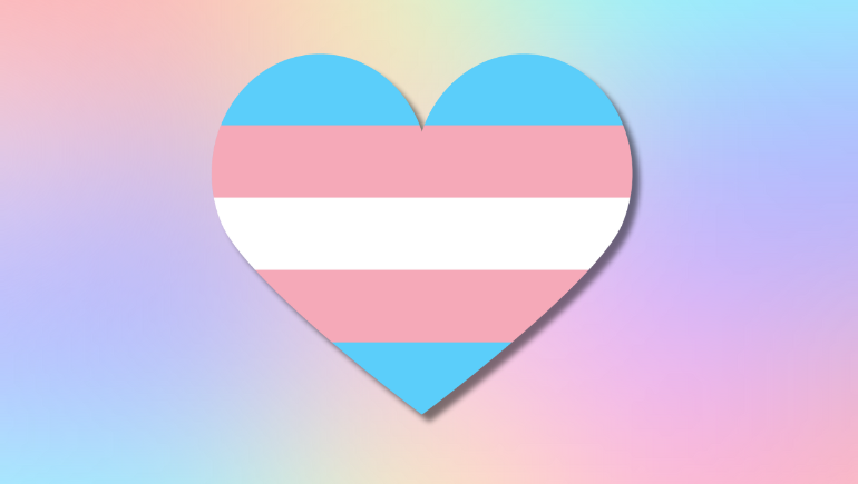 A heart in the colors of the transgender pride flag - light blue, light pink, and white - against a background with shades of pink, blue and purple